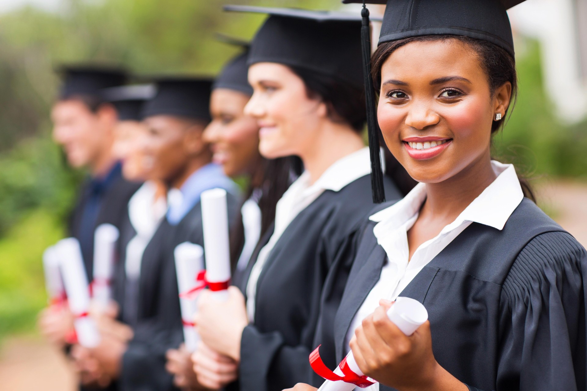 college graduate at graduation with classmates