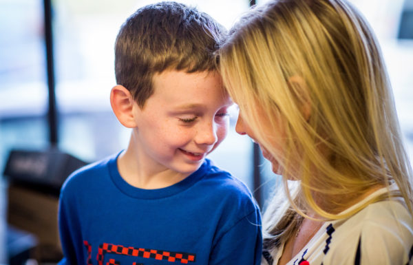 Mum and son touching foreheads