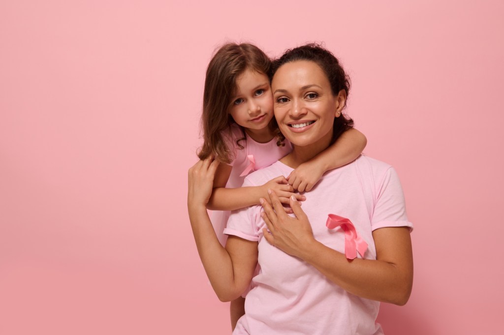 woman and daughter wearing breast cancer awareness pink